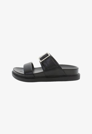 Black leather slide sandal with two wide straps and a rectangular metallic buckle. Flat sole with slight elevation and smooth texture.