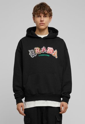 Black hoodie featuring multicolored "DRAMA" text and "I CHOOSE" underneath. Cotton material, kangaroo pocket, ribbed cuffs and hem.