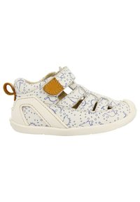 Sandalias blancas para niños con un patrón de dinosaurios azules. Cuentan con correas de velcro y una suela de goma texturizada. Tablero trasero para un fácil uso.