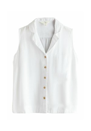 Biela ľanová blúzka bez rukávov na gombíky, s výstrihom na golieri a malou náprsnou náplasťou na ľavej strane.