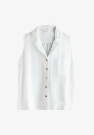 Ujjatlan, fehér lenvászon blúz gombokkal, bevarrt gallérral és egy kis foltzsebbel a bal oldalon.