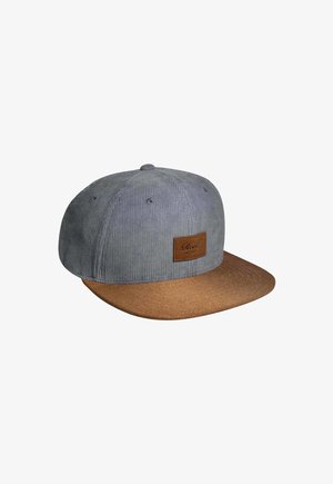 Gray corduroy cap with a brown flat brim and leather logo patch. Textured fabric with stitching detail, round top button, and ventilation holes.