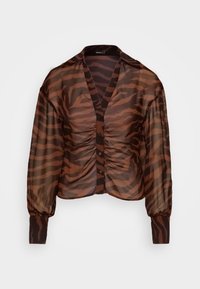 Blusa trasparente marrone con motivo a strisce di tigre, davanti arricciato, chiusura con bottoni e maniche lunghe a sbuffo. Tessuto morbido e leggero.