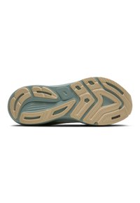 Semelle d'une chaussure de sport avec des motifs de bande de roulement beiges et verts, comportant des rainures et le nom de la marque "Brooks" près du talon.