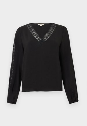 Bluză neagră cu mâneci lungi, decolteu în formă de V și margine de dantelă de-a lungul decolteului și pe partea exterioară a mânecilor, manșete elastice, design simplu și elegant.