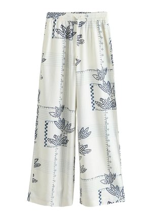 Pantalon blanc à jambes larges avec motifs abstraits de feuilles et de lignes bleu marine, doté d'une taille élastique et d'une coupe décontractée.