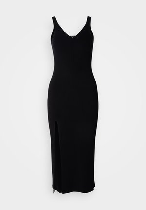Black ribbed knit dress with a fitted silhouette and V-neck. Features a side slit and wide straps, offering a smooth, textured finish.