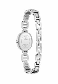 Ceas din oțel inoxidabil cu carcasă ovală, brățară interconectată, finisaj lustruit și logo-ul mărcii gravat pe spate.