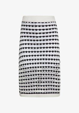 Kötött szoknya váltakozó fekete és fehér csíkokkal, texturált pöttyös mintával és csipkeszerű díszítésekkel az anyagon. Rugalmas derékrész.