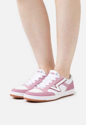 Pink and white low-top sneakers with suede and mesh materials, round toe, white laces, and a rubber sole. Logo on the tongue and side.