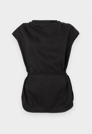 Black sleeveless top with draped neckline, cinched waist belt, and lace trim along the curved hem on a white background.