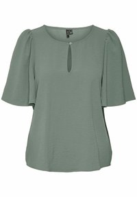 Blusa verde con maniche corte a sbuffo, scollatura rotonda e dettaglio a chiave sul davanti. Tessuto morbido e texturizzato.