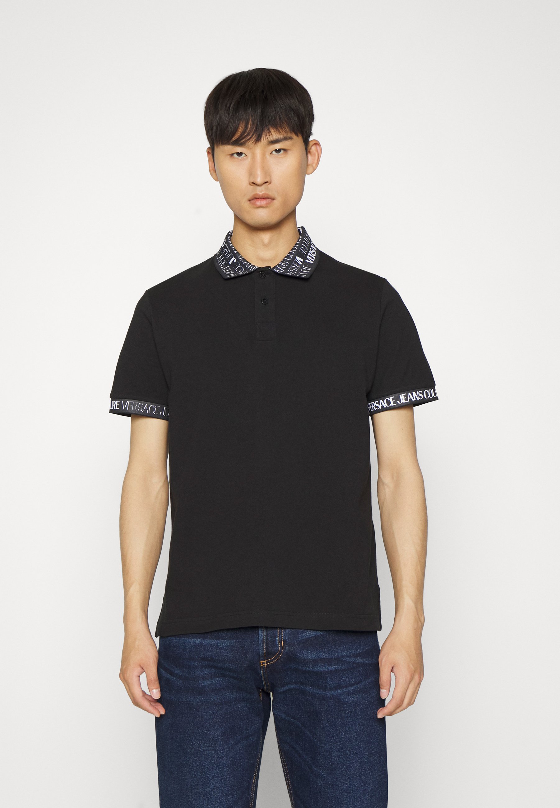 Versace Jeans Couture LOGO ALLOVER - Polo shirt - black - Zalando.de