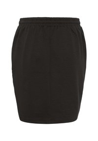 Jupe noire, à longueur genoux, fabriquée en un mélange de coton doux avec une taille élastique. Elle présente une texture lisse et un design simple sans embellissements.
