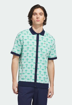 Kurzärmliges Polo mit einem mintgrünen Muster stilisierter Pflanzen. Mit marineblauem Kragen und Saum, Knopfverschluss und glatter Textur.