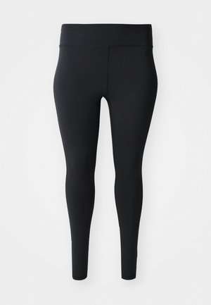 Leggings pretos com uma textura suave e um cós alto, apresentando um ajuste justo ao longo das pernas e sem adornos ou padrões.