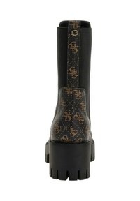 Stivale nero con tacco chunky, con lati elastici, motivo monogramma marrone sul tacco e sul tirante, e suola con profilo profondo.