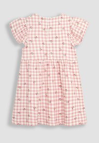 Vaaleanpunainen ruudullinen mekko, jossa on lyhyet volangihihat, kukkakuosi ja nappikiinnitys takana. Kevyt ja teksturoitu puuvillakangas.