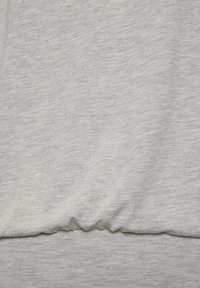 Light grey sweatshirt with a soft texture, featuring a gathered hem at the waist and a smooth, even fabric finish.