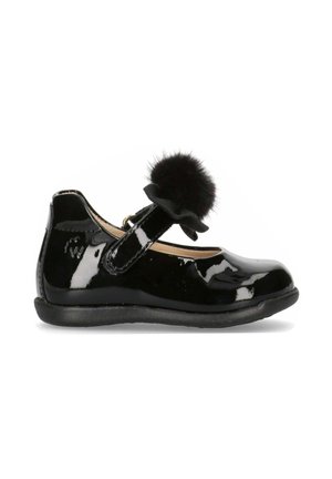 Scarpe Mary Jane in vernice nera con punta rotonda, cinturino in velcro e un pompon decorativo nero sul cinturino. Suola piatta.