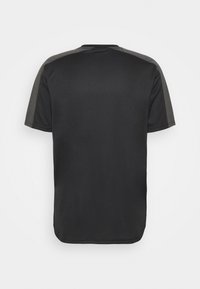 Black short-sleeve shirt with dark gray panels along the shoulders and sleeves, shown from the back against a plain background.
