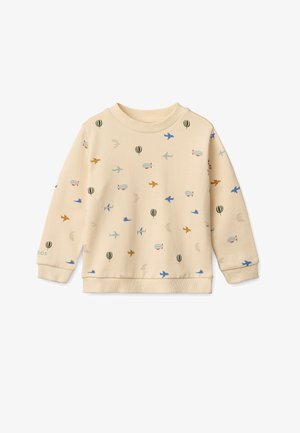 Világos bézs színű pulóver, amelyen nyomott minták találhatók hőlégballonokról, repülőkről és madarakról. Bordás nyakrésszel és mandzsettákkal, puha tapintással.