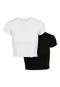 Dvě crop topy: jeden bílý, jeden černý. Oba mají ribovaný povrch a krátké rukávy s vlnitým okrajem. Jednoduchý design.