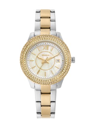 Reloj de pulsera Fossil con correa metálica de oro y plata, bisel decorado con cristales dorados, esfera blanca, marcadores de hora dorados y visualización de la fecha a las tres en punto.
