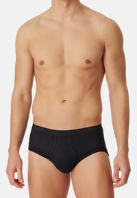 Svarta bomullboxershorts med en slät yta, standard midjeband med logotyp och en formad framdel för passform och komfort.