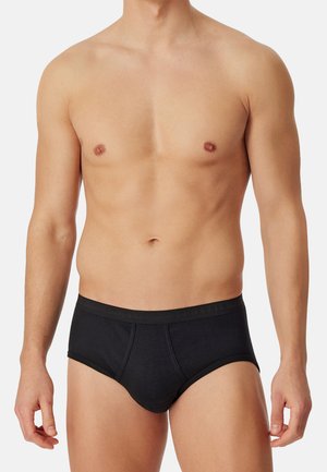 Schwarze Baumwoll-Boxershorts mit glatter Textur, standardmäßiger Taillenausschnitt mit Logo und konturiertem Vorderteil für passgenauen Sitz und Komfort.