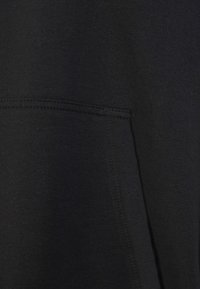 Modanisa BENIN SET - Maxi sukně - black