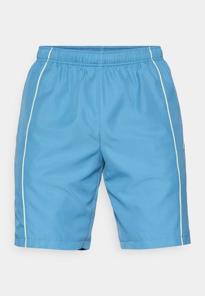 Blue athletic shorts with an elastic waistband, featuring a textured fabric and yellow side stripes. Length reaches above the knee.