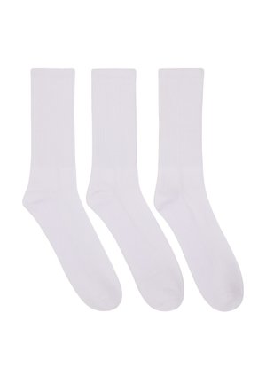 Tre paia di calzini di cotone bianchi con texture a coste, lunghezza media fino al polpaccio, punta senza cuciture e colore uniforme in tutta la superficie.