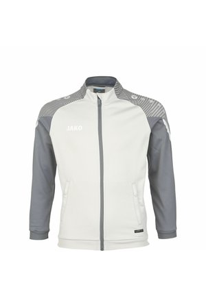 Veste de sport blanche avec des manches et un col gris. Elle présente une fermeture éclair complète, deux poches latérales et des accents texturés sur les épaules.
