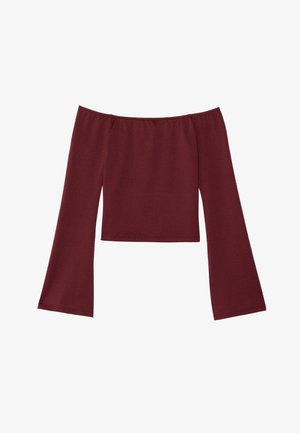 Top s širokimi rokavi v globoki burgundski barvi, ki se nosi pod rameni, z ravnim ovratnikom in krajšo dolžino.
