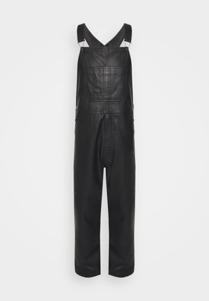 STUDIO ID DUNGAREES - Leather trousers - black