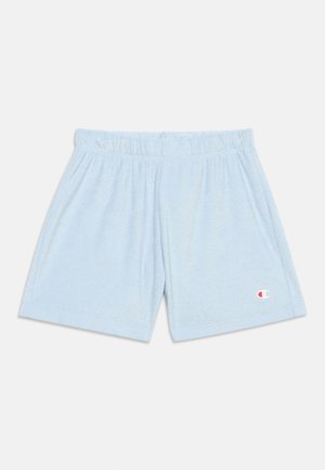 Ανοιχτό μπλε σορτς από πετσετέ ύφασμα με ελαστική μέση και μικρό λογότυπο Champion στο αριστερό πόδι.
