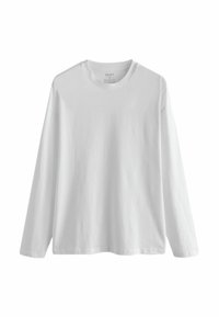 Tricou din bumbac alb, cu mâneci lungi, guler rotund și croi lejer. Textură fină, fără modele sau accente. Eticheta vizibilă în interiorul gulerului.