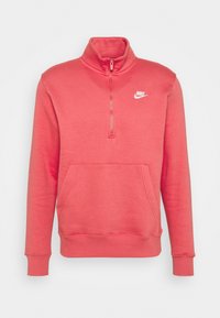 Röd zip-up tröja med hög krage, mjukt tyg, frampåsficka och vitt Nike-logotyp på vänster bröst.