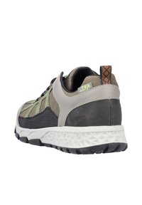 Sneaker with a mix of gray, brown, and black mesh material. Features a textured sole, reinforced heel, and subtle logo detail.