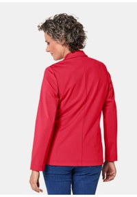 Rode blazer met lange mouwen en een gekleurde kraag. De stof lijkt glad en aansluitend, met nauwkeurige naden en een op maat gemaakte silhouet.