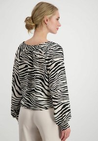 Monari GESMOKTE ZEBRAMUSTER  - Blouse - schwarz gemustert (998)