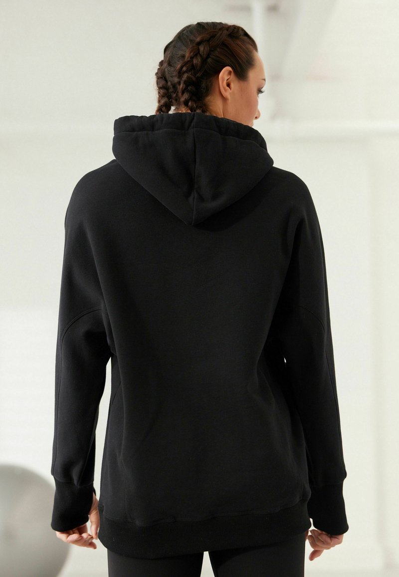 Next NEXT ACTIVE LONGLINE OVERHEAD HOODIE - Sweat à capuche - black/noir -  ZALANDO.FR