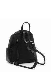 Black leather backpack with a pebbled texture, dual shoulder straps, top handle, and front zip pocket. Rounded shape and silver hardware accents.