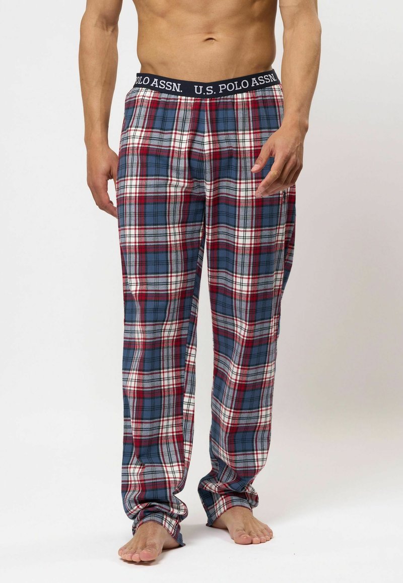 Geruite pyjamabroek in blauw, rood en wit. Gemaakt van zachte stof met een elastische tailleband waarop "U.S. Polo Assn." staat. Ruime pasvorm, volle lengtes.