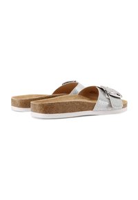 Sandal con glitter argento, dotate di una chunky suola in sughero, una fodera interna liscia e un dettaglio in metallo sulla cinghia. Suola in gomma bianca.