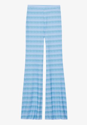 Light blue flared pants with a wavy pattern in varying shades of blue and white. Made from a soft, stretchy fabric. Simple waistband.