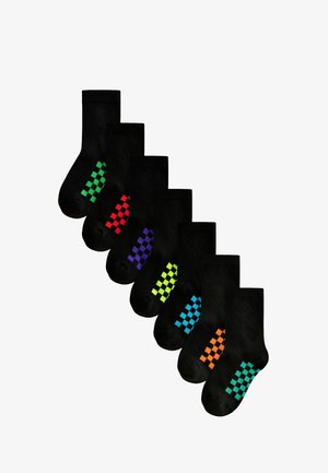 Black cotton socks featuring colorful checkerboard patterns in green, red, purple, yellow, blue, and orange on the sides.