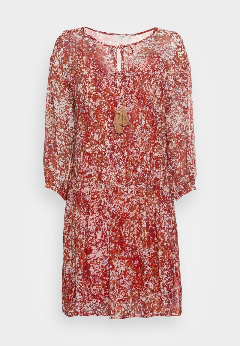 Robe mi-longue rouge, blanche et marron à motif, manches longues transparentes, encolure ronde et détail à nouer avec pompons à l'avant.
