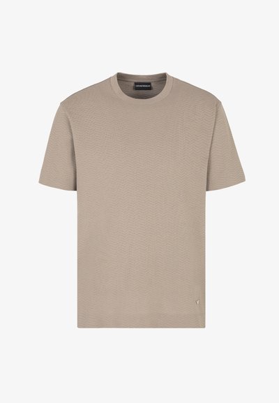 T-shirt beige a maniche corte con un motivo a zigzag testurizzato, scollatura rotonda e branding discreto sul lato inferiore. Realizzato in tessuto leggero.